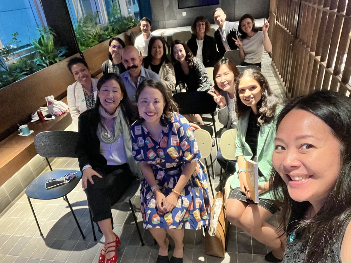 Future Green community members at monthly meetup — a diverse group of sustainability professionals