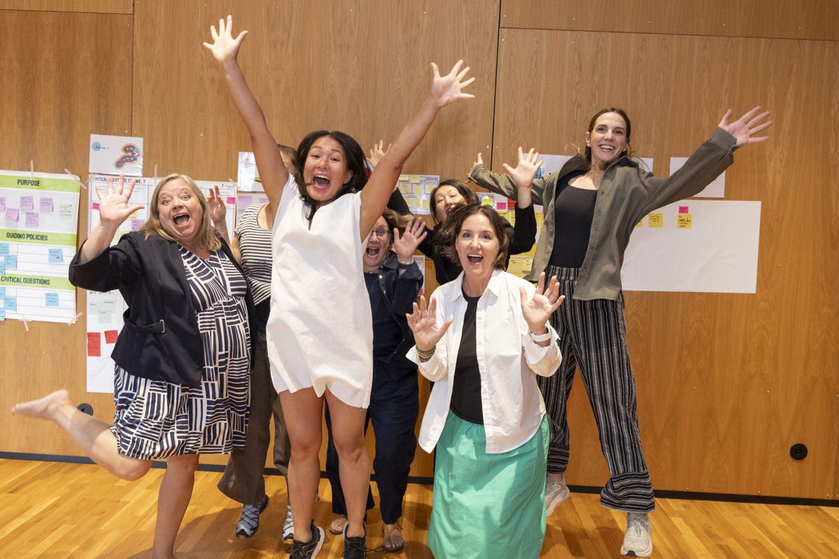 Retreat participants celebrating in the workshop room