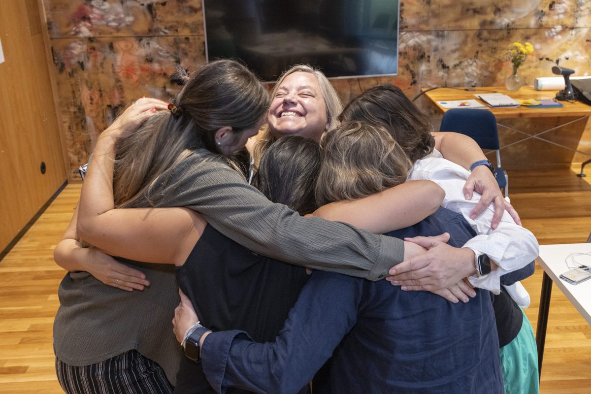 Participants hugging at the end of the week