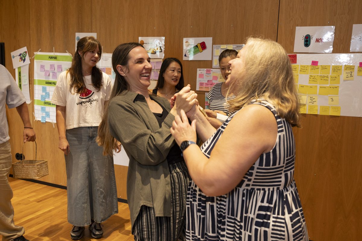 Participants laughing together between sessions