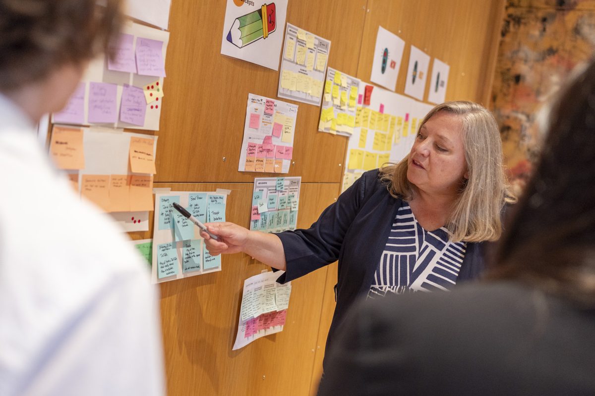 A participant facilitating at the wall