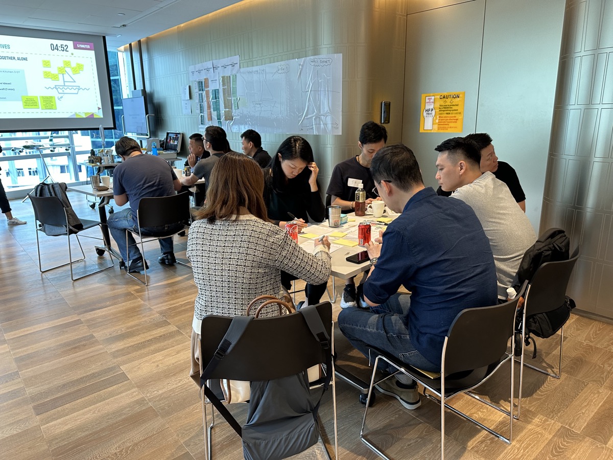 Close-up of participant writing on workshop materials