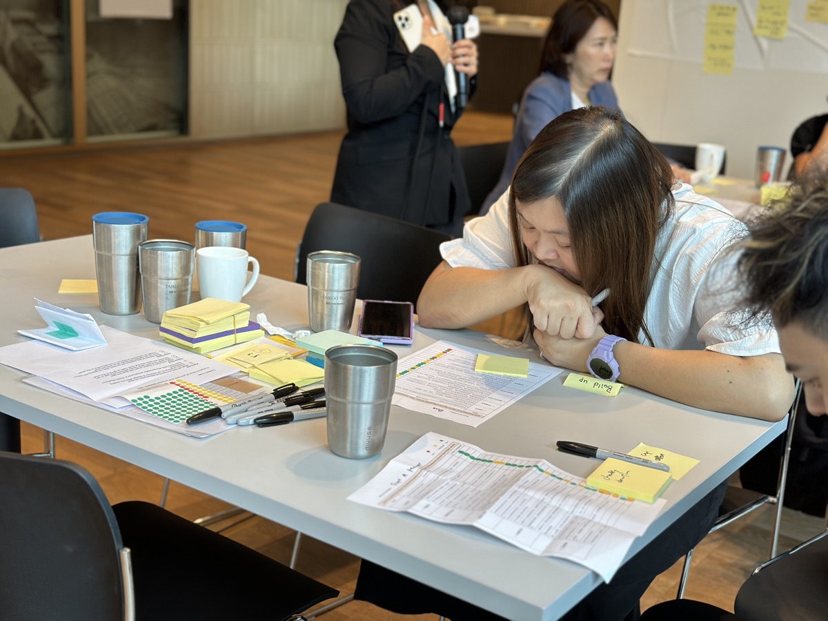 Participant taking notes during facilitation session
