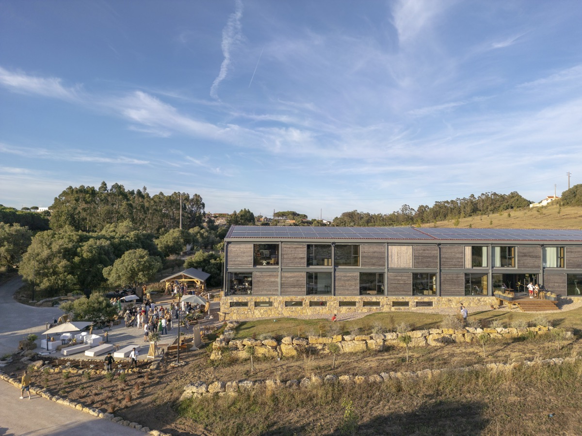 Quinta da Bufala — modern sustainable building nestled in Sintra hills with guests gathering on terrace